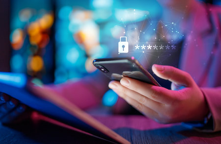 Lock the phone with a password for mobile cybersecurity or a password to confirm login in the online banking application. Cyber security threats. Laptop and smartphone.の写真素材