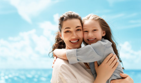 Happy family at nature. Mother and child are having fun and enjoying summer days.の写真素材