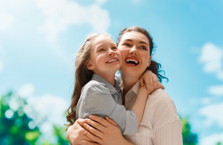 Happy family at nature. Mother and child are having fun and enjoying summer days.の写真素材