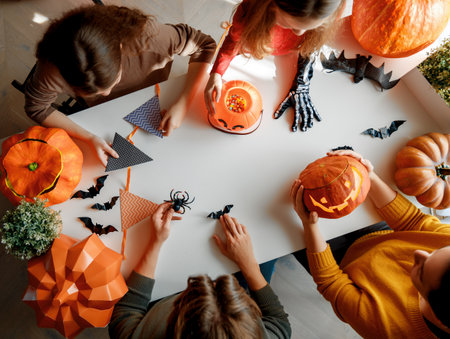 Mother, father and their kids  preparing for Halloween. Top view.の写真素材