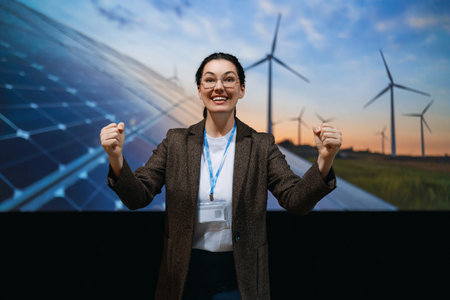 A woman is talking about renewable energy on stage.
