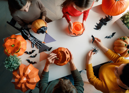 Mother, father and their kids  preparing for Halloween. Top view.の写真素材