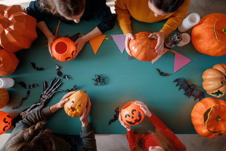 Mother, father and their kids  preparing for Halloween. Top view.の写真素材