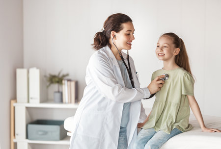 Girl patient with a doctor in medical office.の写真素材