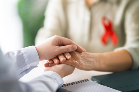 Colour ribbon for concept of illness awareness. Female patient listening to doctor in medical office. Raising knowledge on people living with disease.の写真素材