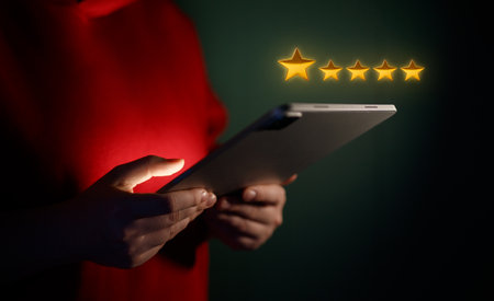 Person is holding a tablet to give a rating application