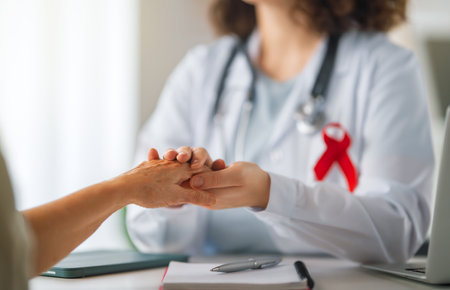 Colour ribbon for concept of illness awareness. Female patient listening to doctor in medical office. Raising knowledge on people living with disease.の写真素材