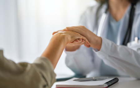 Female patient listening to a doctor in hospital.の写真素材