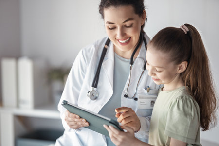 Girl patient listening to a doctor in medical office.の写真素材