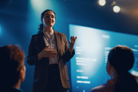 A woman is speaking on stage about the future of AI technologies.の写真素材