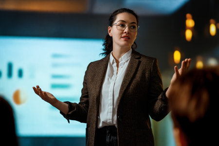 A woman is speaking on stage about the future of AI technologies.の写真素材