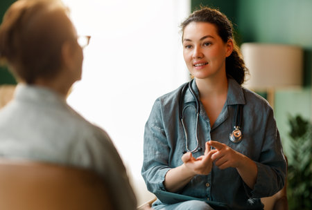 Female patient and a doctor talking in hospital.の写真素材