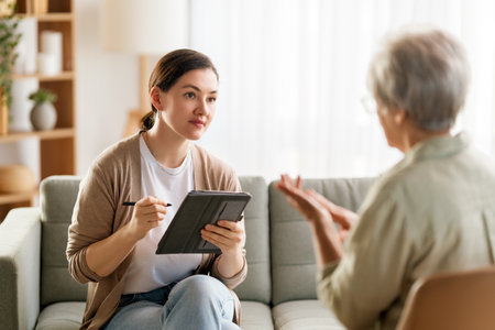 Consultation of senior female patient on reception for psychologist.の写真素材
