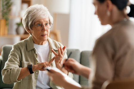 Consultation of senior female patient on reception for psychologist.の写真素材