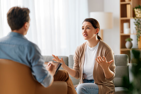 Consultation of young female patient on reception for psychologist.の写真素材