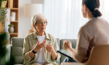 Consultation of senior female patient on reception for psychologist.の写真素材