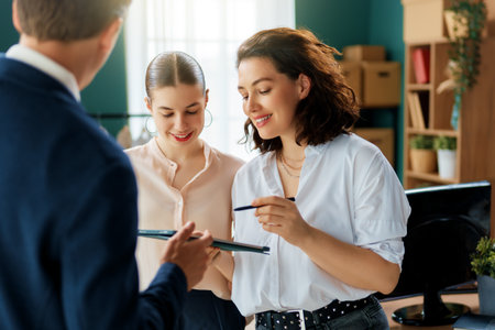 Young people fashion designers are working in studio.の写真素材