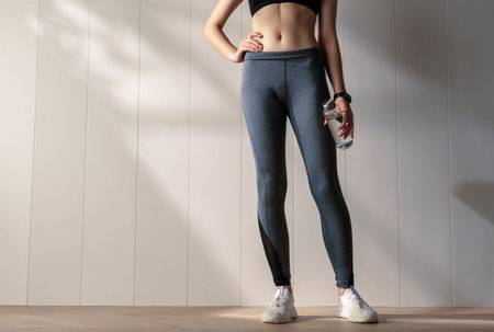 Fitness athlete close-up. Healthy lifestyle and sport concepts. Woman in fashionable sportswear.の写真素材
