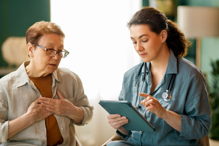 Female patient and a doctor talking in hospital.の写真素材