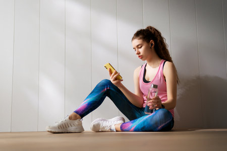 Healthy lifestyle and sport concepts. Woman in fashionable sportswear is doing exercise.