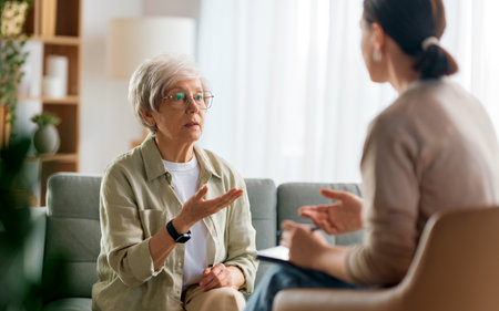 Consultation of senior female patient on reception for psychologist.の写真素材