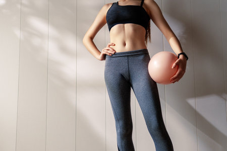 Fitness athlete close-up. Healthy lifestyle and sport concepts. Woman in fashionable sportswear.の写真素材