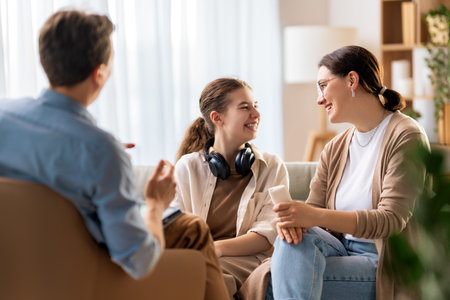 Consultation of teenager and mother on reception for psychologist.の写真素材