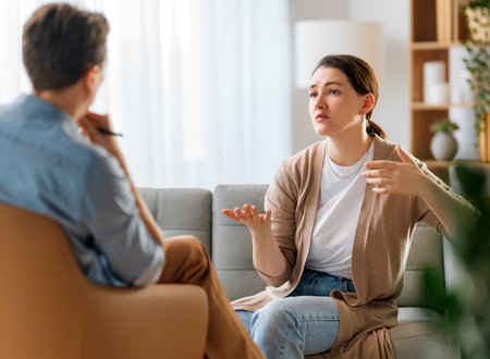 Consultation of young female patient on reception for psychologist.の写真素材