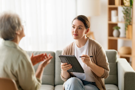 Consultation of senior female patient on reception for psychologist.の写真素材