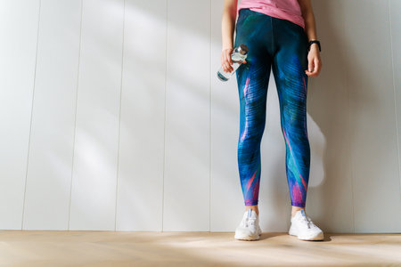 Fitness athlete close-up. Healthy lifestyle and sport concepts. Woman in fashionable sportswear.