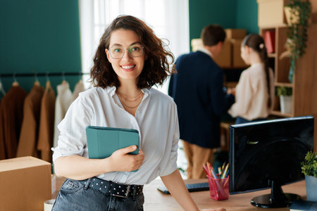 Young people fashion designers are working in studio.