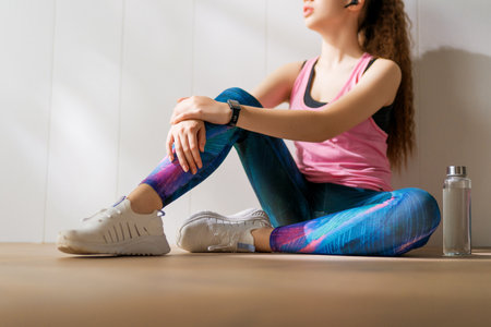 Healthy lifestyle and sport concepts. Woman in fashionable sportswear is doing exercise.