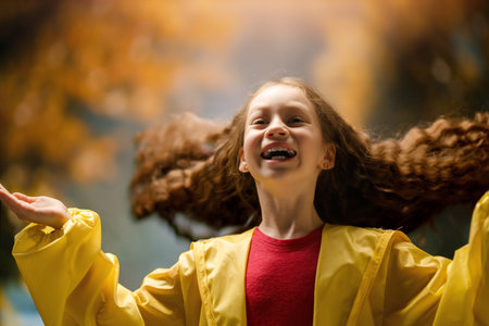 Happy girl. Child on autumn walkの写真素材