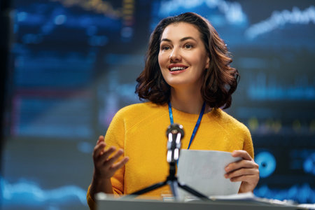 A young woman is giving a presentation at a conference.