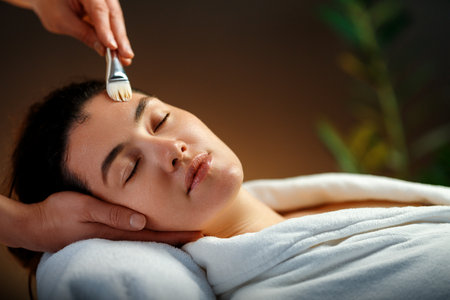 Facial treatment in spa salon. Skin care and massage. Cosmetologist at work