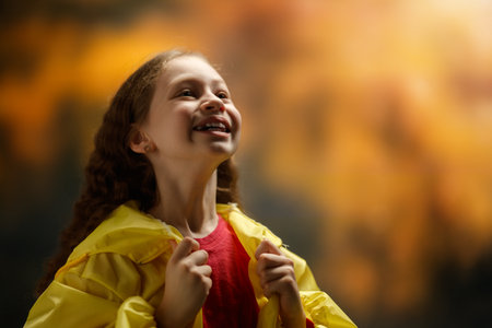 Happy girl. Child on autumn walkの写真素材