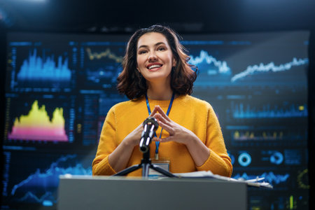A young woman is giving a presentation at a conference.の写真素材