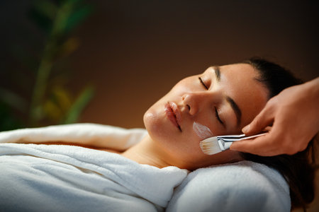 Facial treatment in spa salon. Skin care and massage. Cosmetologist at workの写真素材