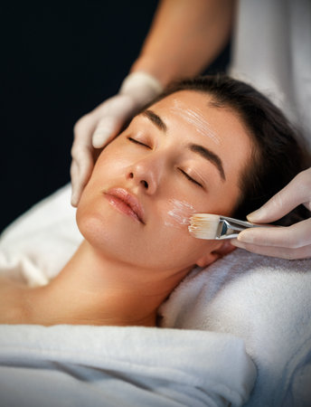 Facial treatment in spa salon. Skin care and massage. Cosmetologist at workの写真素材