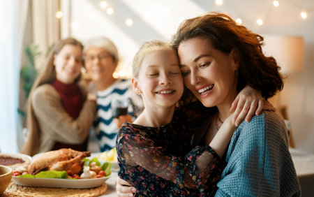 Thanksgiving Day, Autumn feast. Happy family sitting at the table and celebrating holiday. Traditional dinner. Grandmother, mother and children.の写真素材