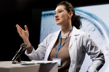 A woman is giving a presentation at a conference on care products.