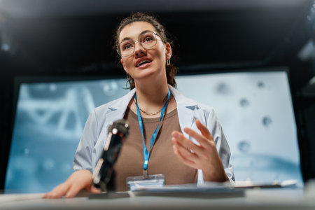 A woman is giving a presentation at a conference on care products.の写真素材