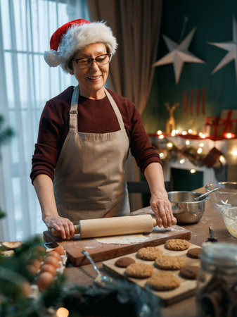 Merry Christmas and Happy Holidays. Family preparation holiday food. Grandmother cooking cookies.の写真素材