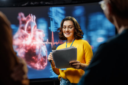 A young woman is giving a presentation at a medical conference.の写真素材