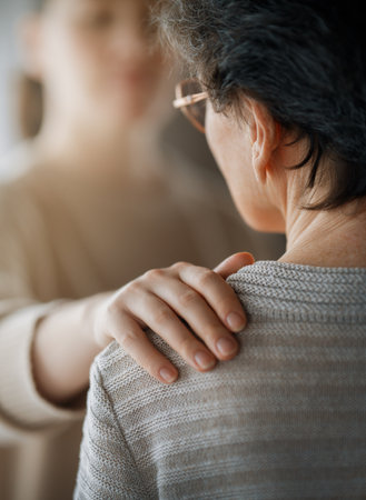 Patient and caregiver spending time together. Senior woman and her adult daughter.