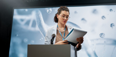 A woman is giving a presentation at a conference on care products.の写真素材
