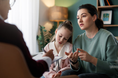 Consultation of child and mother on reception for psychologist.の写真素材
