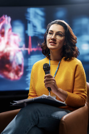 A young woman is giving a presentation at a medical conference.