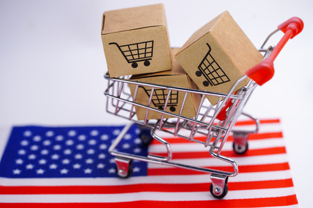 Box with shopping cart logo and America USA flag : Import Export Shopping online or eCommerce delivery service store product shipping, trade, supplier concept.の写真素材