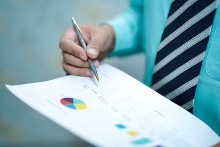 Young business smart manager working with new success startup project analyze graph plan : Banking, Account, Investment Analytic research data economy, trading company concept.の写真素材